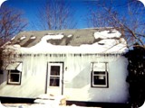Major Ice Dams On The Front Of An Existing Older Home