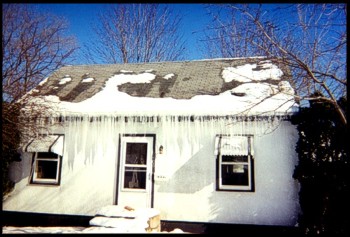 This Home Has Major Ice Dams That Are Blocking The Front Entrance To The Home
